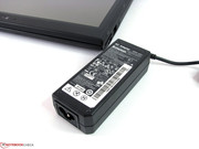 The power adapter supplies 65 watts and causes CPU throttling in certain scenarios.