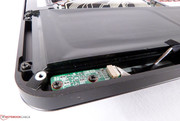 The battery is screwed inside the case and is connected via small ribbon cables.