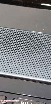 The speakers are located above the keyboard.
