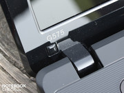 The hinges have a somewhat wobbly hold on the lid and allow it to teeter evidently.