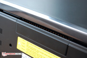The fan blows out of the device's rear.