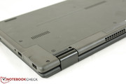 Ports are close to the back of the notebook and away from the front