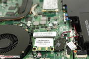 Half-mini PCIe WLAN card adjacent to system battery and fan
