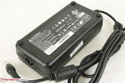 Medium-sized power adapter (16x8x4 cm) outputs 19 V