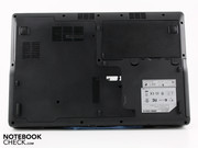 The underside houses a battery compartment and a large access panel.