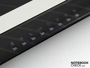 A whole row of brightly flashing lights shows activity (WLAN, hard drive, number lock etc).