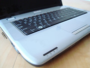 ... the palm rest area and the area surrounding the keyboard are a silvery grey...