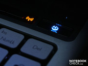 The power and program start/ WLAN icons glow in different colours.