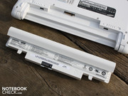 The battery sticks out from the bottom of the base unit, but has feet.