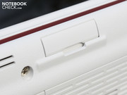 The card reader, also on the front edge, has a plastic cover.