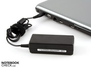 The power adapter supplies 65 watts. A bit tight for the maximum power consumption of 74 watts.
