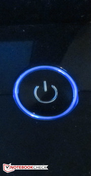 The illuminated power button adds a colored highlight.