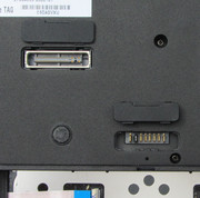 ...a docking station port (left), and the connector for an external battery. All connectors are protected by plastic covers.