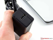 The power cord has a USB socket. It could be used to charge a smartphone or connect the Vaio Ethernet dongle