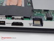 The cover of the RJ-45 jack is integrated into the bottom plastic.