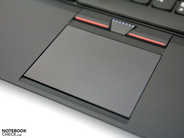 Small touchpad with textured surface and trackpoint buttons.