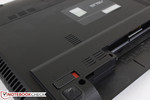 Though hard to see, the speakers are underneath the double grilles adjacent to the battery. The grille directly above houses the system fan. Though hard to see, the speakers are underneath the double grilles adjacent to the battery. The grille directly above houses the system fan.