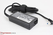Small AC adapter (9 x 5 x 2 cm) outputs 19.5 V
