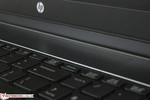 Speaker grilles above keyboard