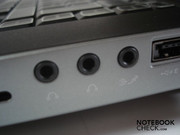 Three audio sockets (headphone, line-out, microphone/line in) on the right
