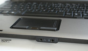 The touchpad has a black border.