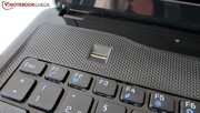 A fingerprint scanner is located above the keyboard.