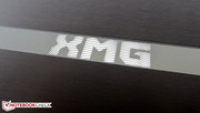 The XMG logo lights up in blue during use.