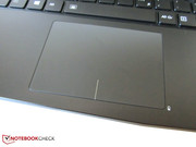 The glossy touchpad surface quickly attracts dirt.