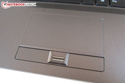 A fingerprint scanner sits between the mouse keys.