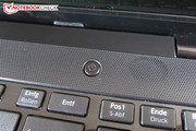 A speaker is placed on the right, next to the power button.