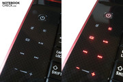 The touch-sensitive multimedia bar lights up red as soon as the Qosmio is turned on