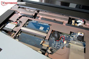 The wireless module and half the RAM slots are placed under the keyboard.