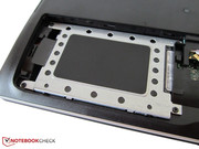 The 750 GB HDD is underneath a metal frame.