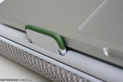 The rubber stoppers fold out and prevent the laptop from sliding forward.