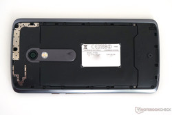 The back cover is removable to change the cover. The battery behind is screwed into the body.