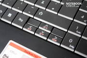The arrow keys are also the control for display brightness and volume.