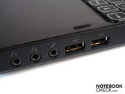 The right has three audio connections and two USB 2.0 ports.