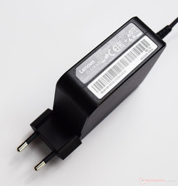 The power adapter is rated for 65 watts