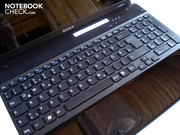 The keyboard has a good pressure point, but clatters quite loudly and yields evidently in the number pad area.