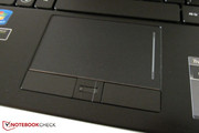 A fingerprint scanner is located between the mouse keys.