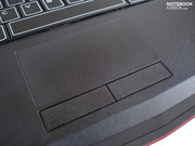 A fine honeycomb pattern covers the touchpad.