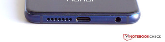 Lower edge: 3.5-mm headset jack, USB port, speaker, microphone