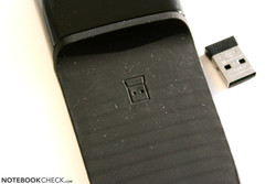 The USB dongle can be magnetically attached to the bottom surface.