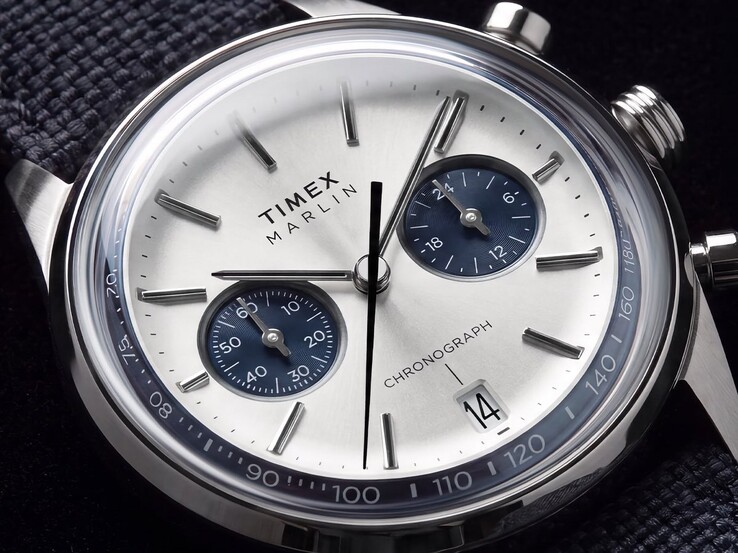 Close-up of the Timex Marlin Jet Chronograph TW2Y89900 showing its silver-white dial, navy subdials, applied hour markers, baton hands, tachymeter scale, and date window.