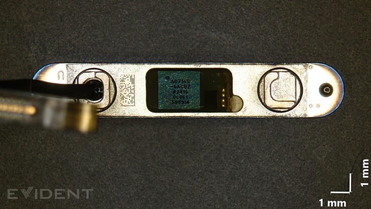 The Evident Scientific microscope providing a closeup view of the capacitive side camera button. (Image source: iFixit)