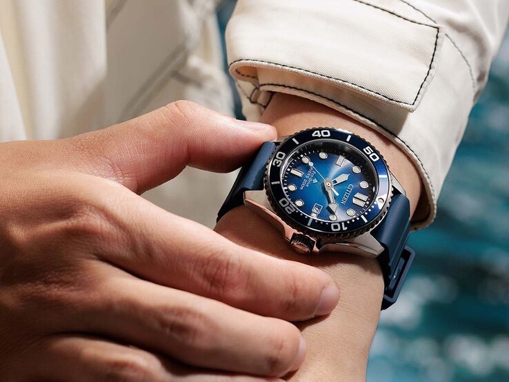 Person wearing the Citizen Promaster Marine BN0267-04L with a blue gradient dial and blue strap on their wrist.