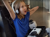 Taylor joins Owen, Shan, Grover, and other young gamers in "We All Win" by Microsoft. (Source: YouTube/Microsoft)