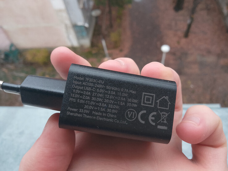 The phone definitely isn't afraid of falling but the charger might be. (Image source: Sergey Tarasov - Notebookcheck)