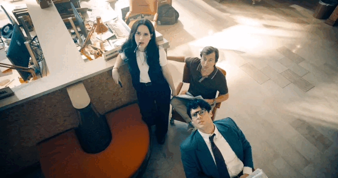 Lois, Jimmy, and Clark look up in the Daily Planet newsroom (Image source: Warner Bros. Pictures / Photo by Jessica Miglio via Batman News)