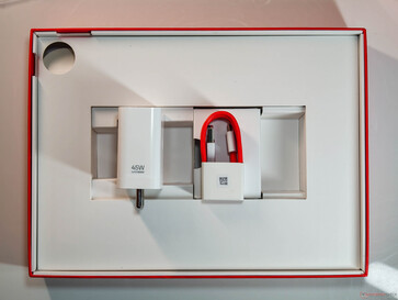 A 45 W charger, USB Type-A to Type-C cable, and a SIM ejector tool (for the 5G version) come in the box. (Image Source: Notebookcheck)